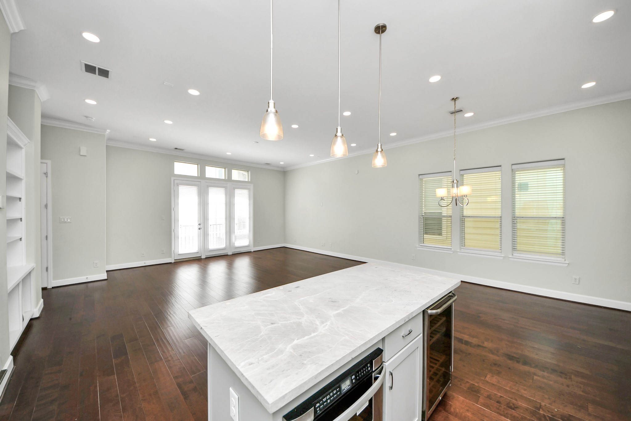 1716 Stuart Street Houston, TX 77004 - Photo 19 of 39 a view of kitchen and hall with wooden floor