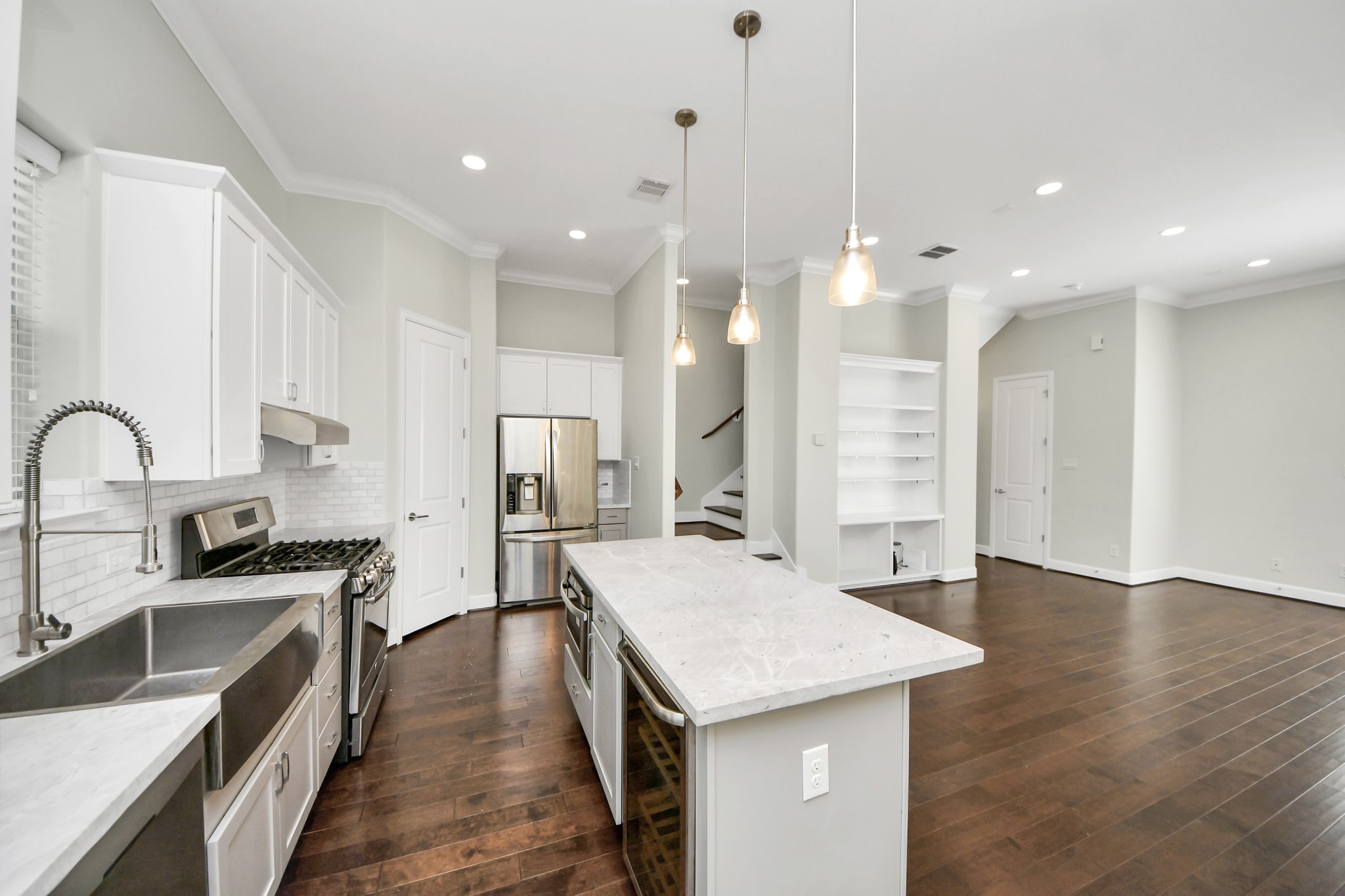 1716 Stuart Street Houston, TX 77004 - Photo 20 of 39 a kitchen with stainless steel appliances granite countertop a sink stove and refrigerator