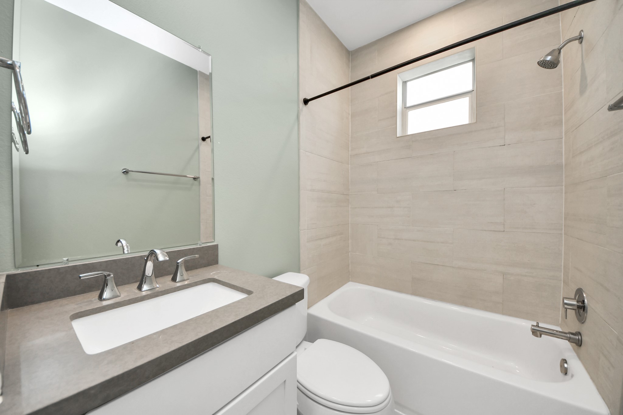 1716 Stuart Street Houston, TX 77004 - Photo 34 of 39 a bathroom with a granite countertop sink toilet a mirror and shower