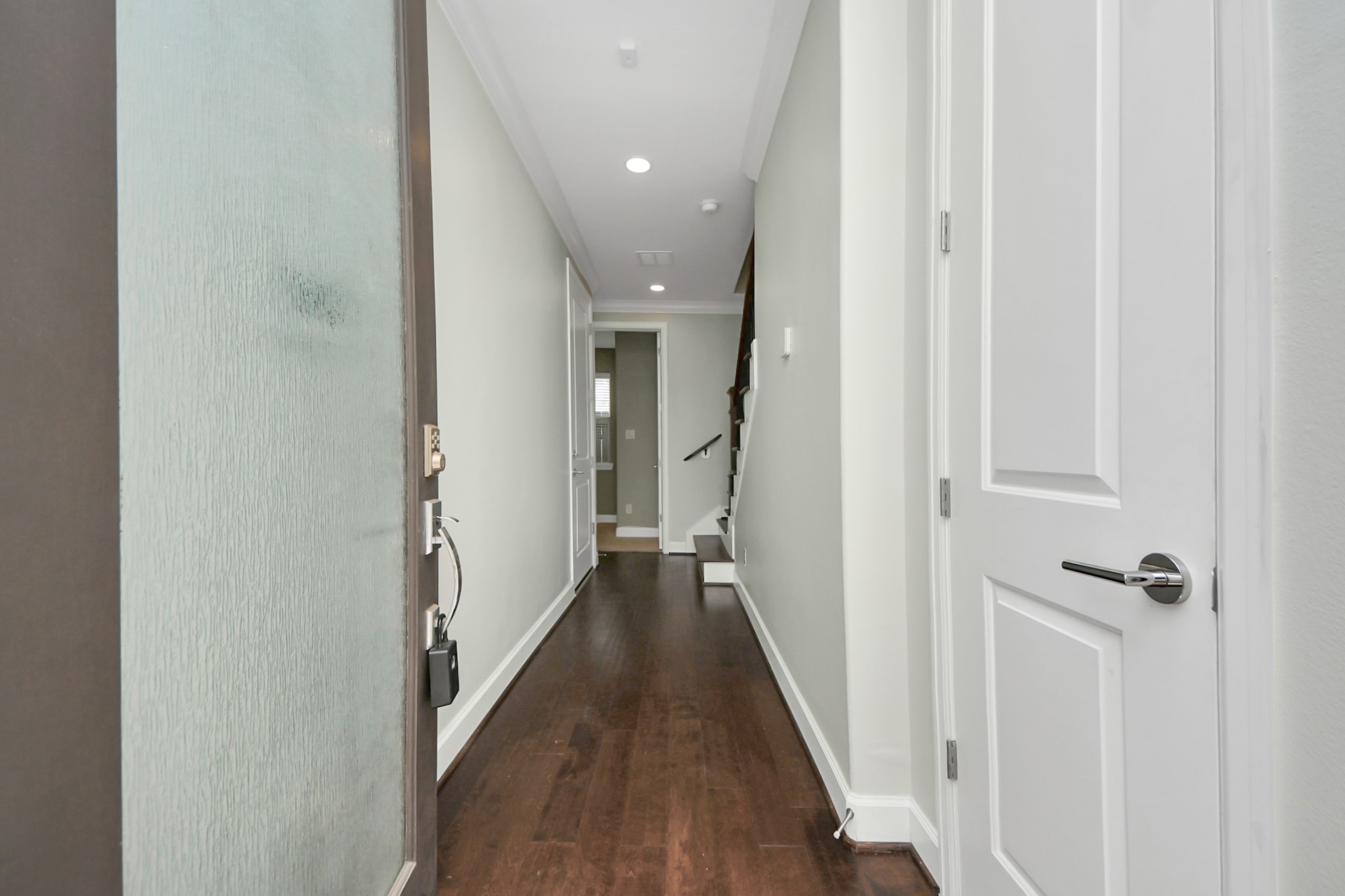 1716 Stuart Street Houston, TX 77004 - Photo 5 of 39 a view of a hallway with wooden floor