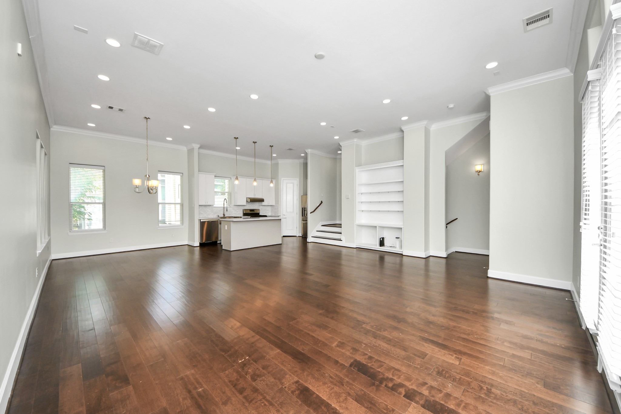 1716 Stuart Street Houston, TX 77004 - Photo 9 of 39 a view of an empty room and kitchen with hardwood floor