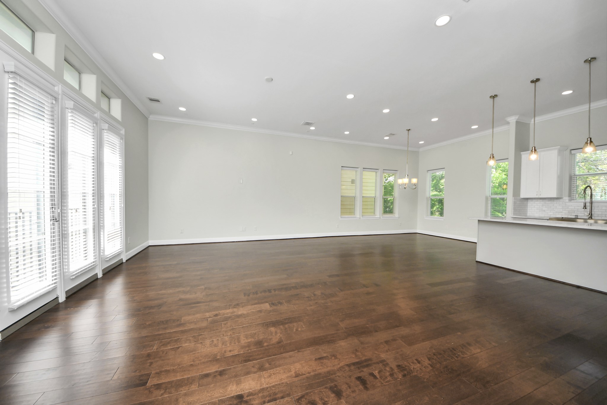 1716 Stuart Street Houston, TX 77004 - Photo 10 of 39 a view of an empty room with wooden floor and a window