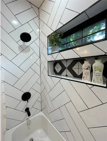 a bathroom with a sink and a shower