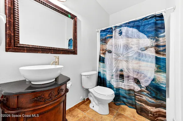 a bathroom with a toilet and a sink