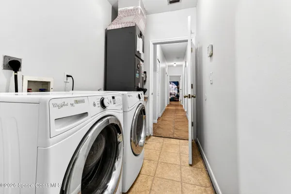 a view of a kitchen with washer and dryer
