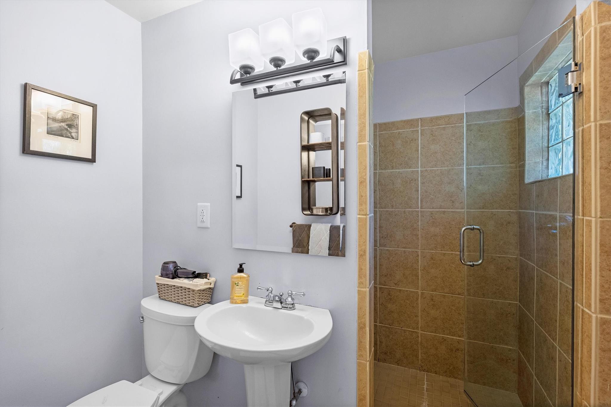 631 Seneca Place Charlotte, NC 28210 - Photo 11 of 21 a bathroom with a sink toilet and shower