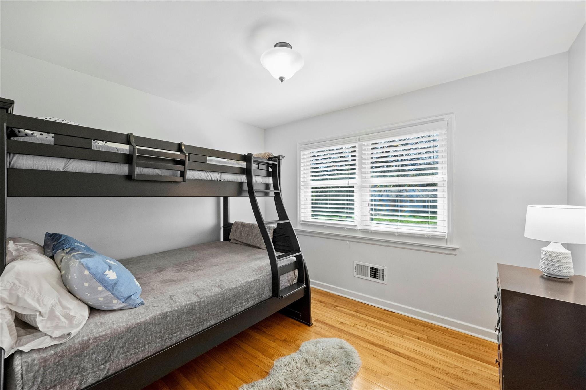631 Seneca Place Charlotte, NC 28210 - Photo 12 of 21 a bedroom with a bed and a window