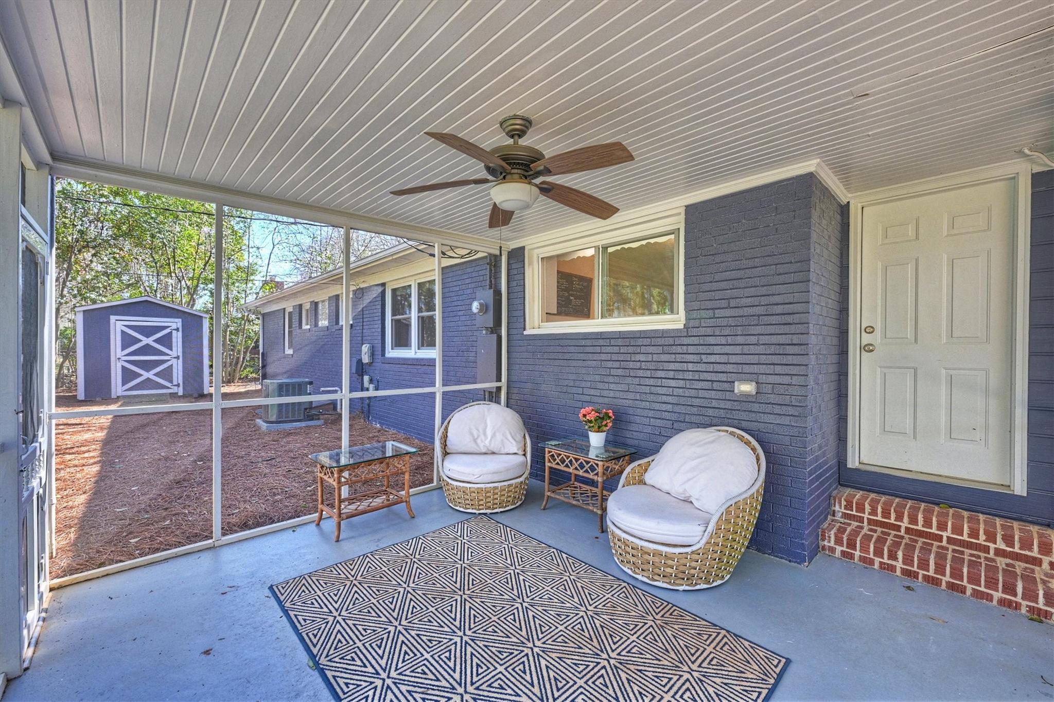631 Seneca Place Charlotte, NC 28210 - Photo 16 of 21 a living room with furniture a window and a rug