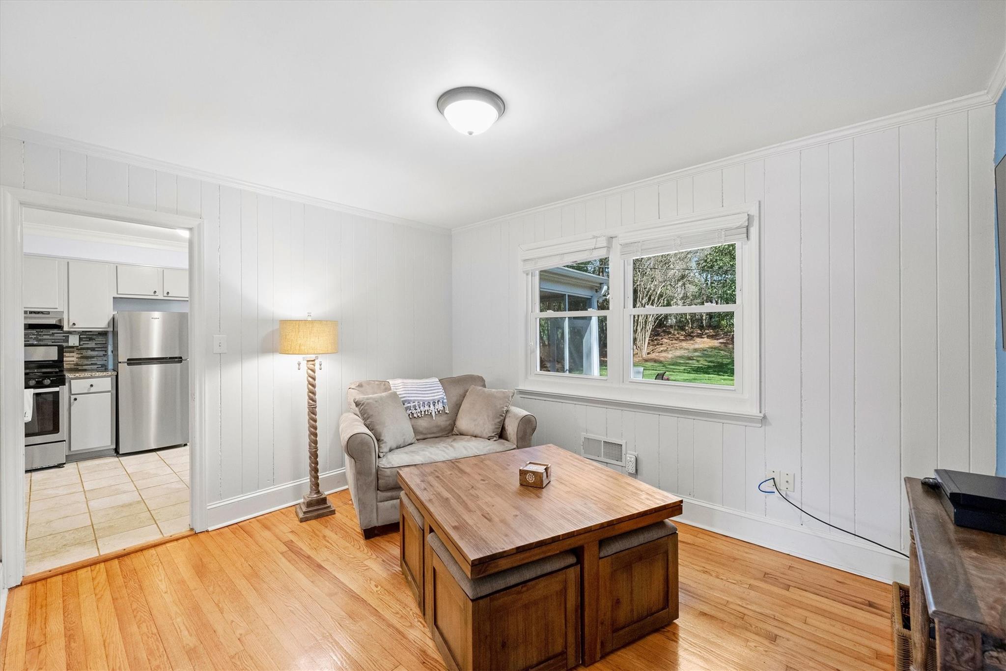 631 Seneca Place Charlotte, NC 28210 - Photo 6 of 21 a living room with a couch and a table
