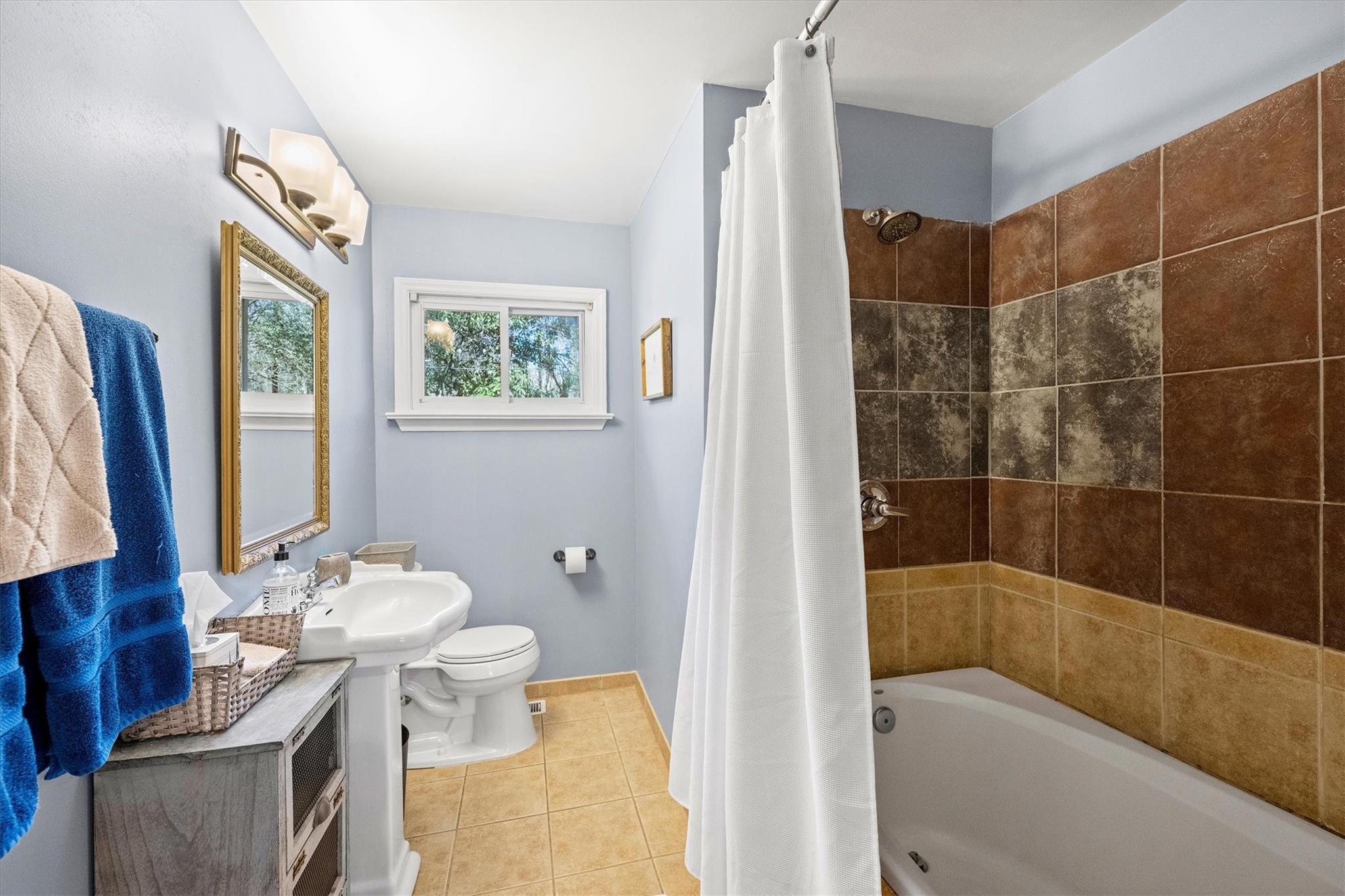 631 Seneca Place Charlotte, NC 28210 - Photo 9 of 21 a bathroom with a sink toilet and shower