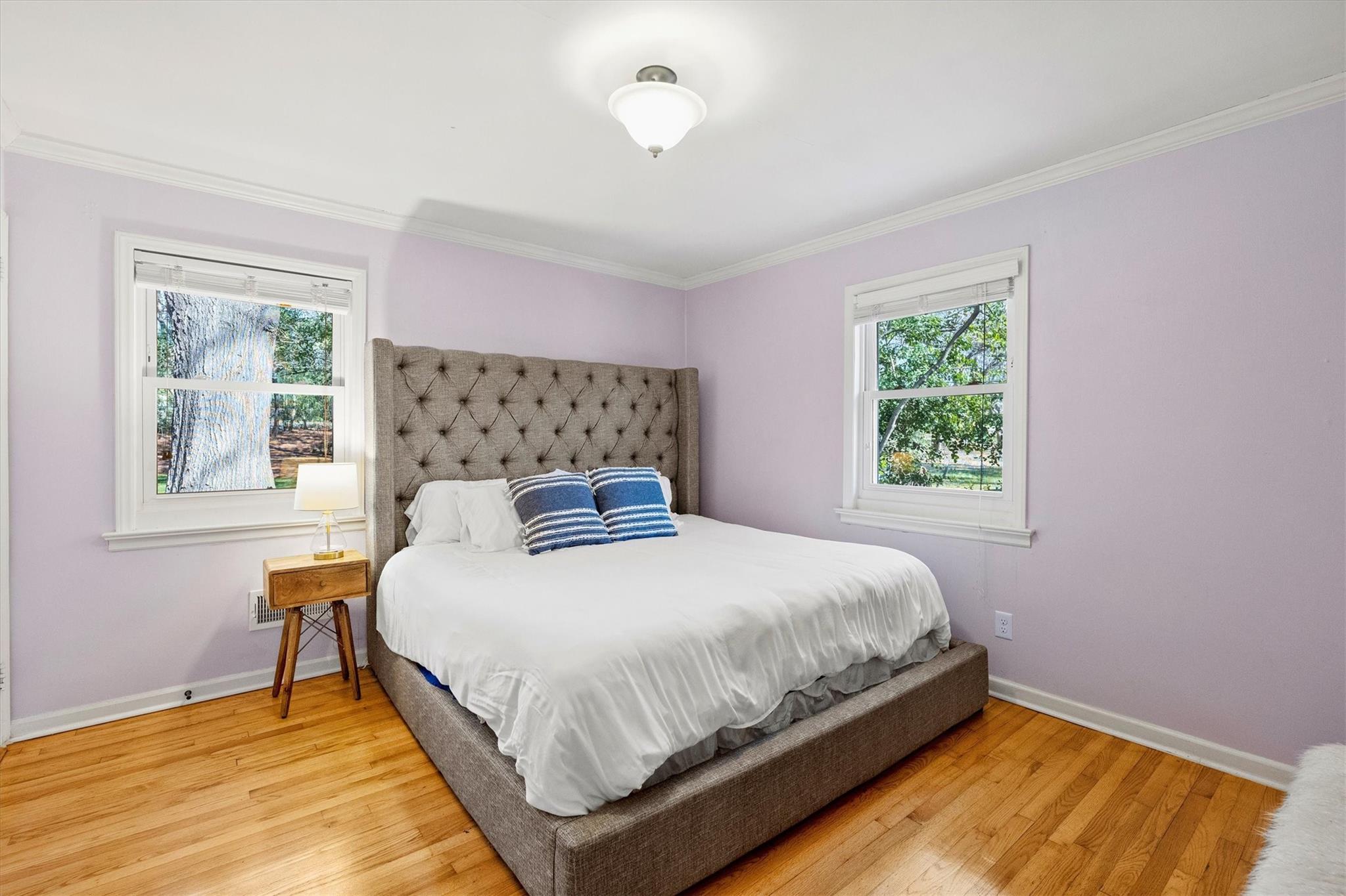 631 Seneca Place Charlotte, NC 28210 - Photo 10 of 21 a bedroom with a bed and a window