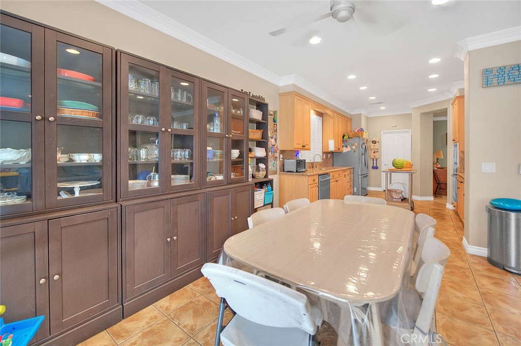 Undisclosed Address Upland, CA 91784 - Photo 12 of 38 a large kitchen with a table and chairs