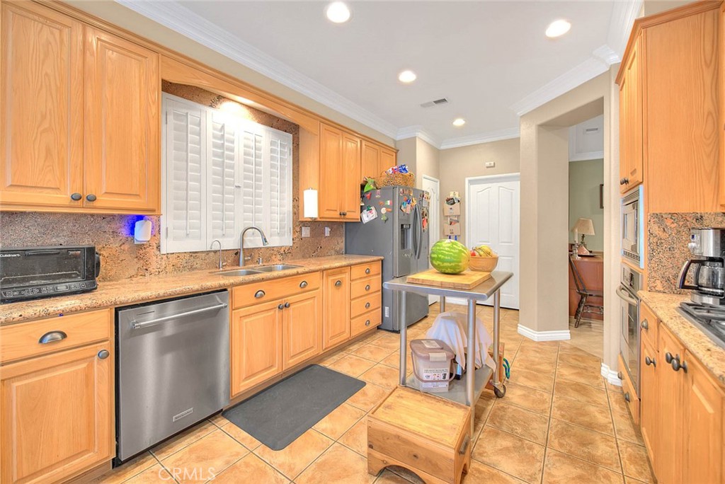 Undisclosed Address Upland, CA 91784 - Photo 15 of 38 a kitchen with stainless steel appliances granite countertop a stove a sink and a refrigerator