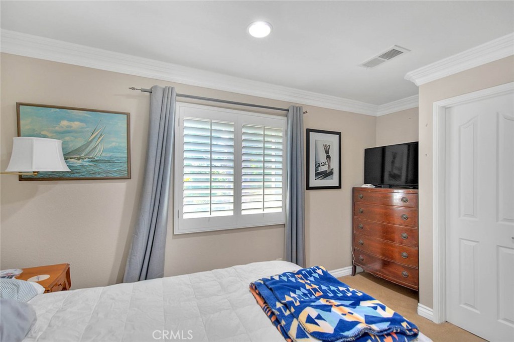 Undisclosed Address Upland, CA 91784 - Photo 24 of 38 a bedroom with a bed and furniture