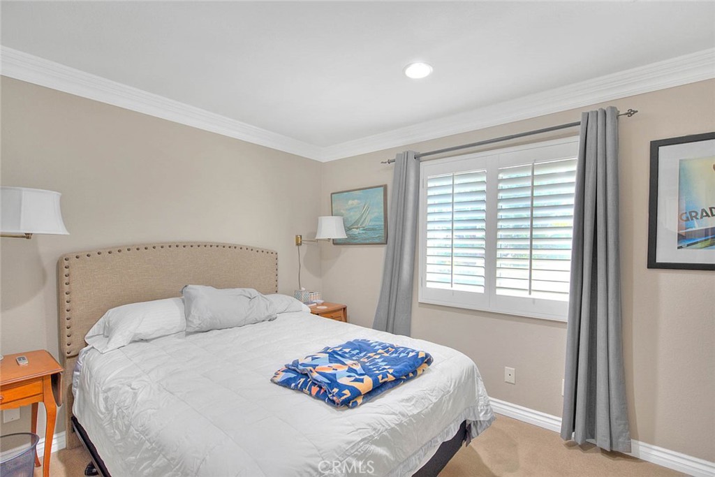 Undisclosed Address Upland, CA 91784 - Photo 25 of 38 a bedroom with a large bed and a window