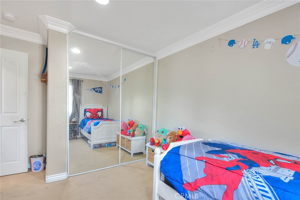 Undisclosed Address Upland, CA 91784 - Photo 27 of 38 a playing room with toys and a couch