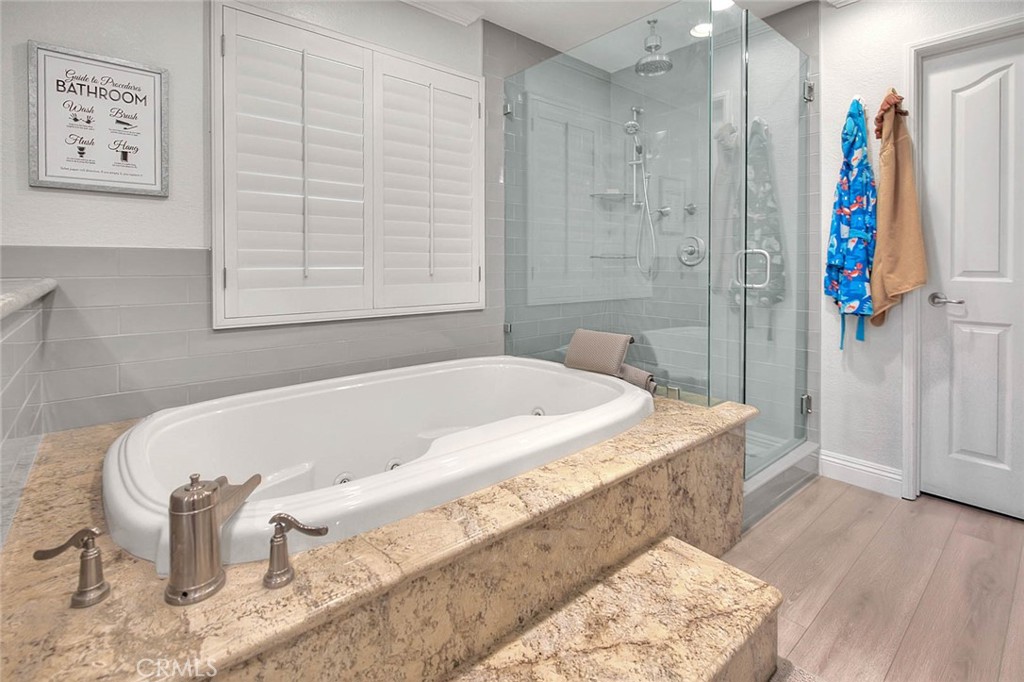 Undisclosed Address Upland, CA 91784 - Photo 29 of 38 a spacious bathroom with a bathtub and shower