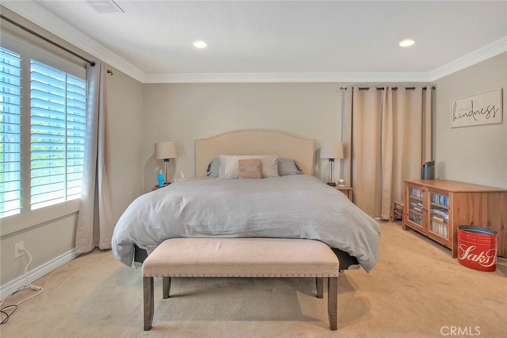 Undisclosed Address Upland, CA 91784 - Photo 31 of 38 a bedroom with a bed and a cabinets