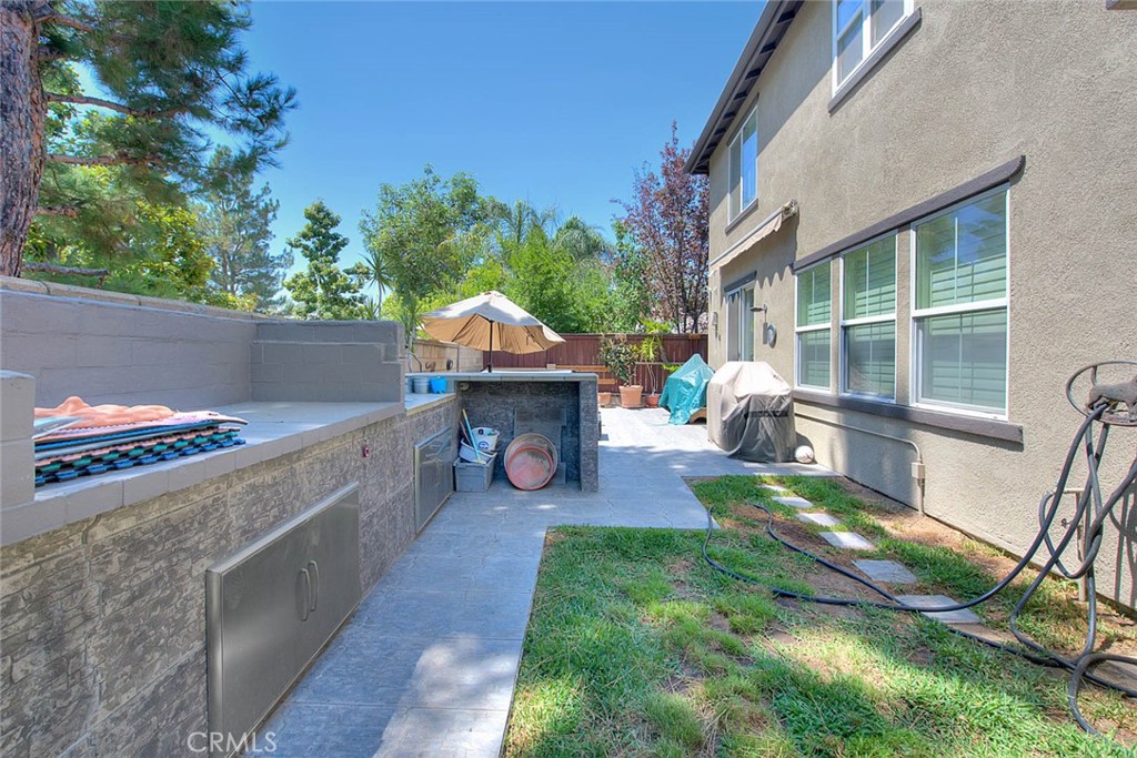 Undisclosed Address Upland, CA 91784 - Photo 34 of 38 a view of house with backyard outdoor seating and hardwood