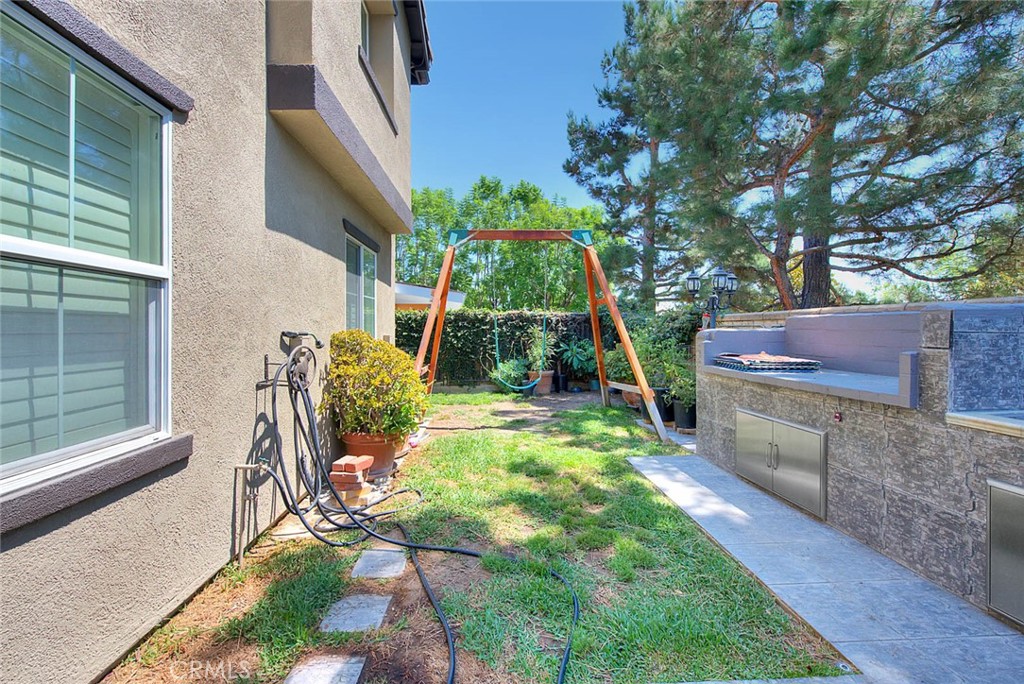 Undisclosed Address Upland, CA 91784 - Photo 36 of 38 a backyard of a house with table and chairs