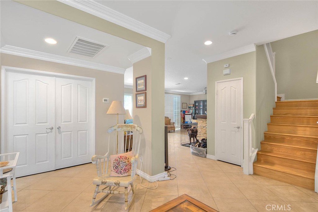 Undisclosed Address Upland, CA 91784 - Photo 5 of 38 a hallway with dining room and wooden floor
