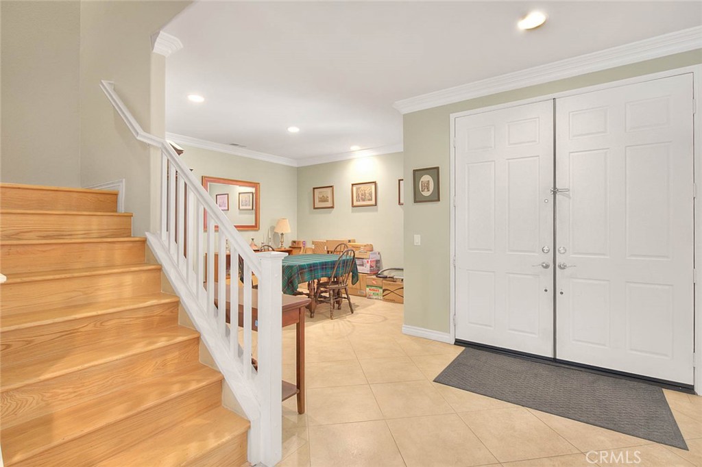 Undisclosed Address Upland, CA 91784 - Photo 7 of 38 a view of a hallway with wooden floor and stairs