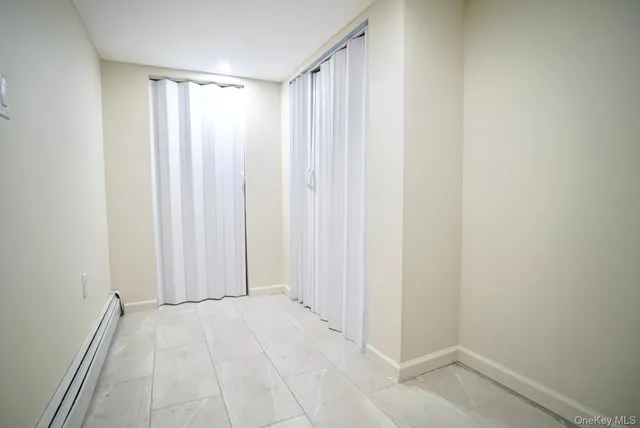 a view of a bathroom with a shower curtain