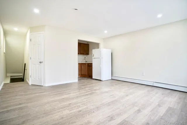 a view of a livingroom with a kitchen
