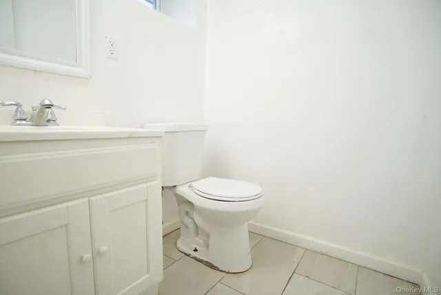 a bathroom with a toilet and a sink