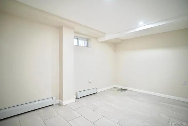 an empty room with white walls