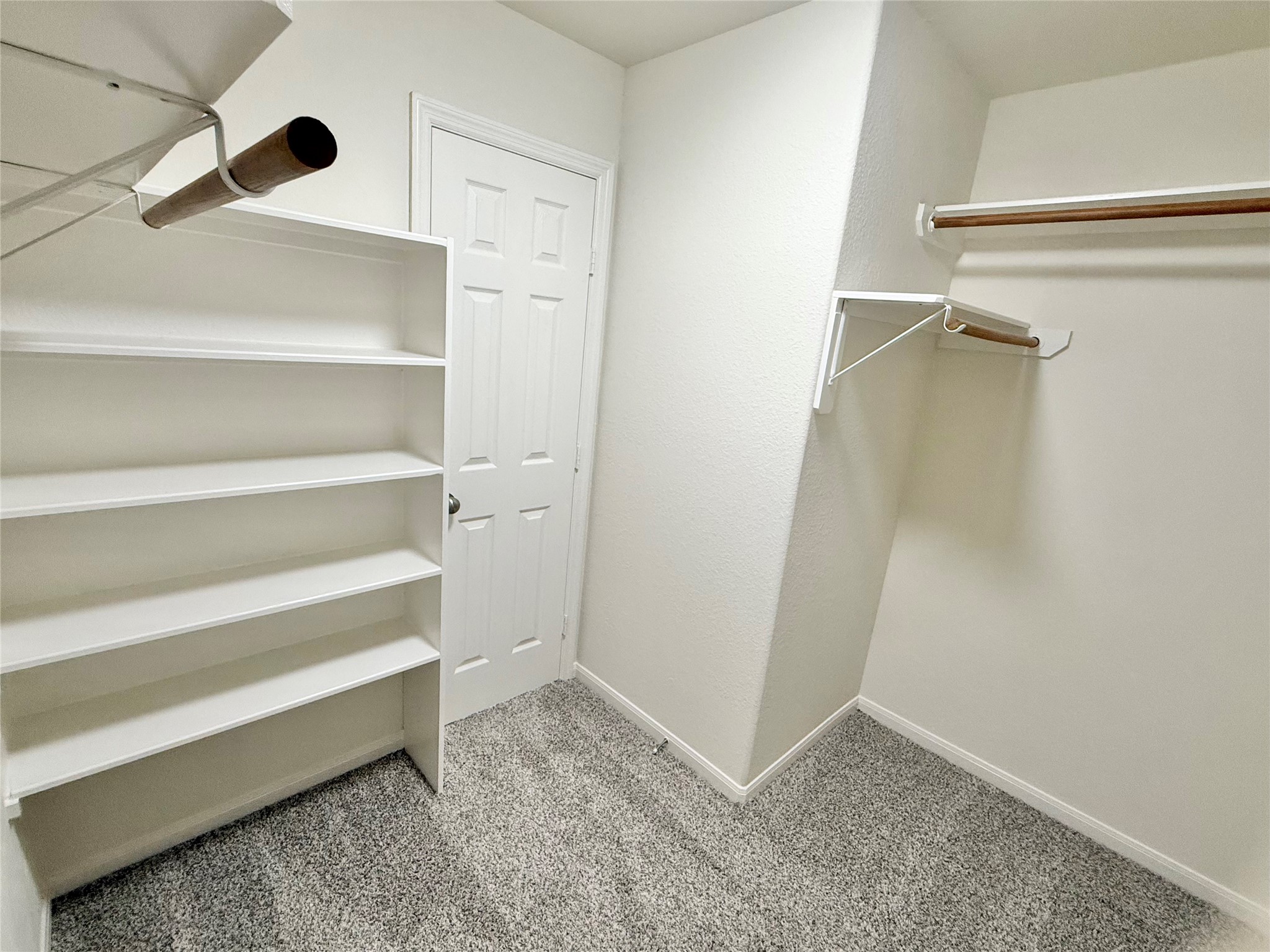 3430 Falcon Trail Court Spring, TX 77373 - Photo 25 of 31 Primary walk-in closet with so much storage space AND walk-in access to attic!