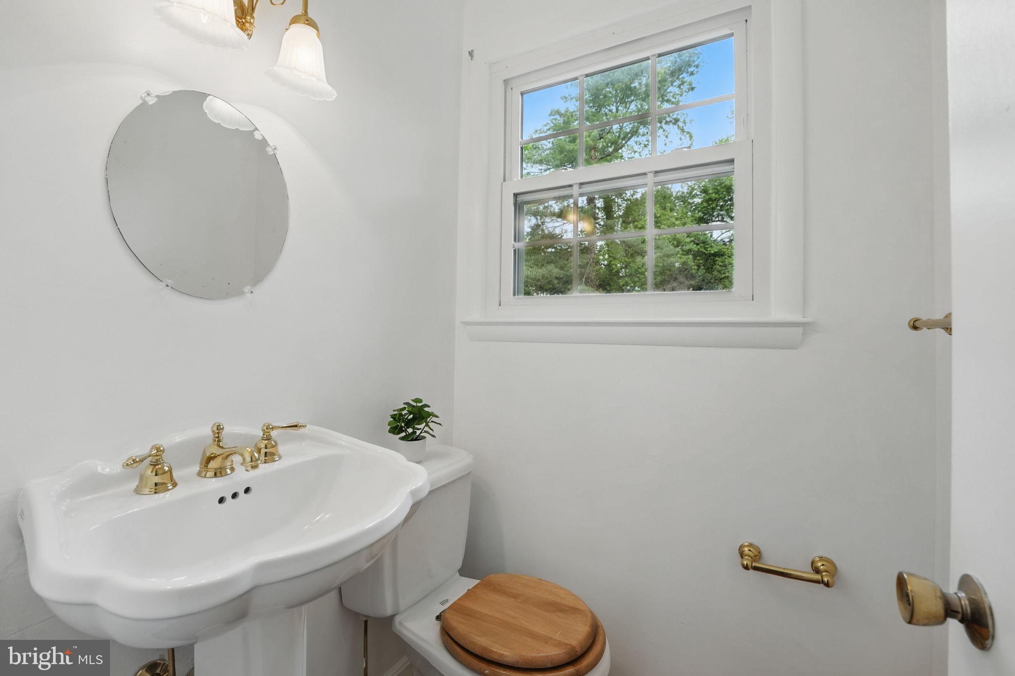 2524 Swift Run Street Vienna, VA 22180 - Photo 12 of 55 a bathroom with a sink and a mirror