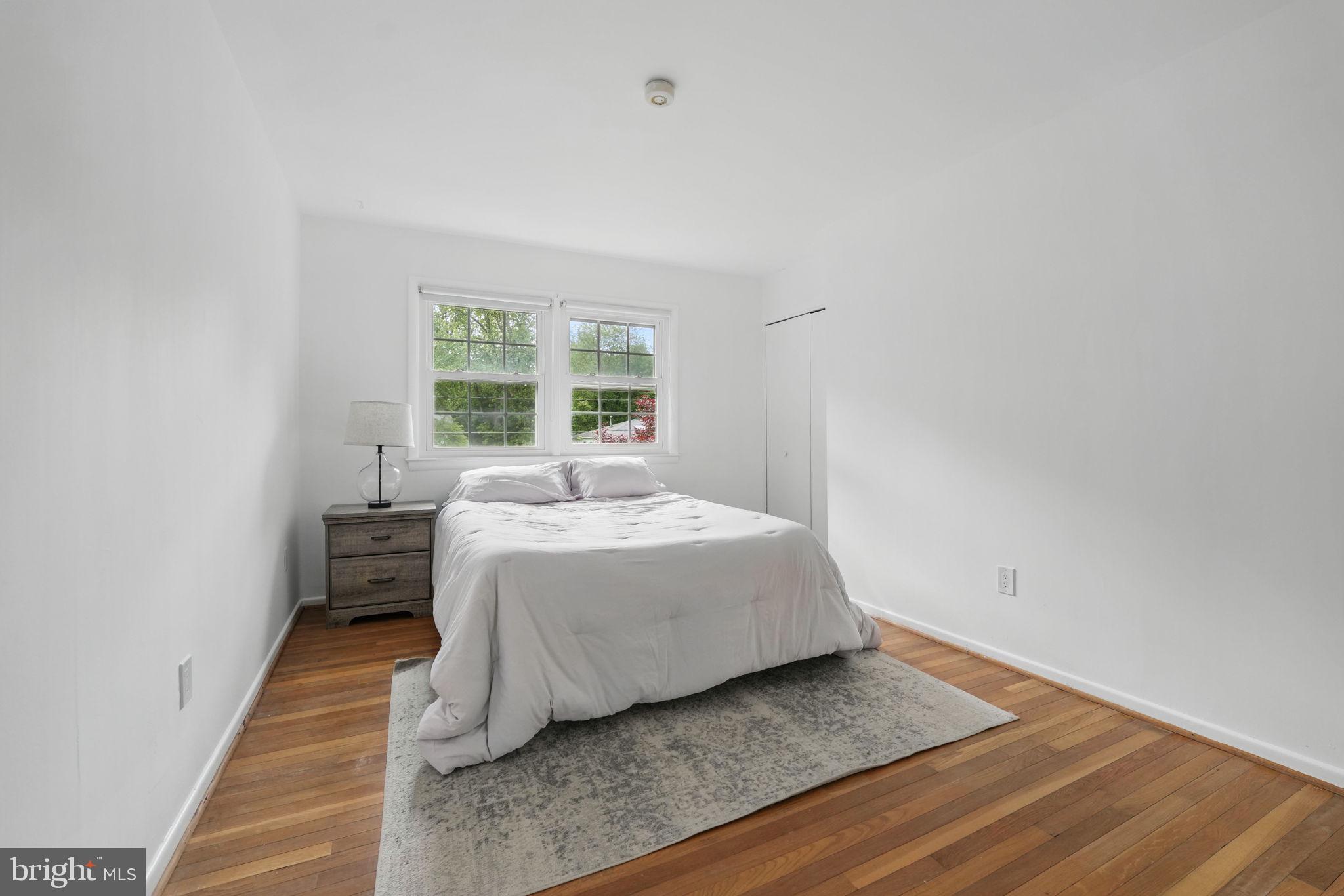 2524 Swift Run Street Vienna, VA 22180 - Photo 15 of 55 a bedroom with a bed and a window