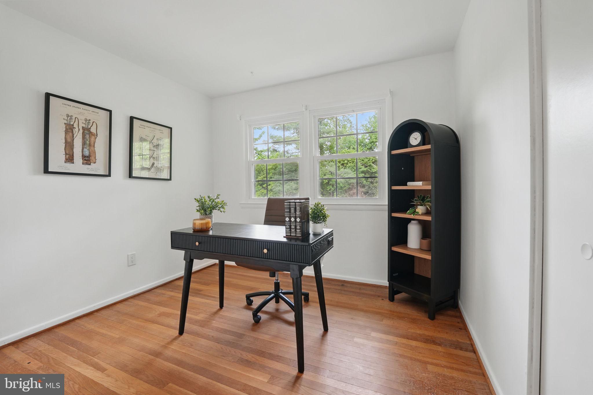2524 Swift Run Street Vienna, VA 22180 - Photo 18 of 55 a view of a workspace with furniture and a potted plant