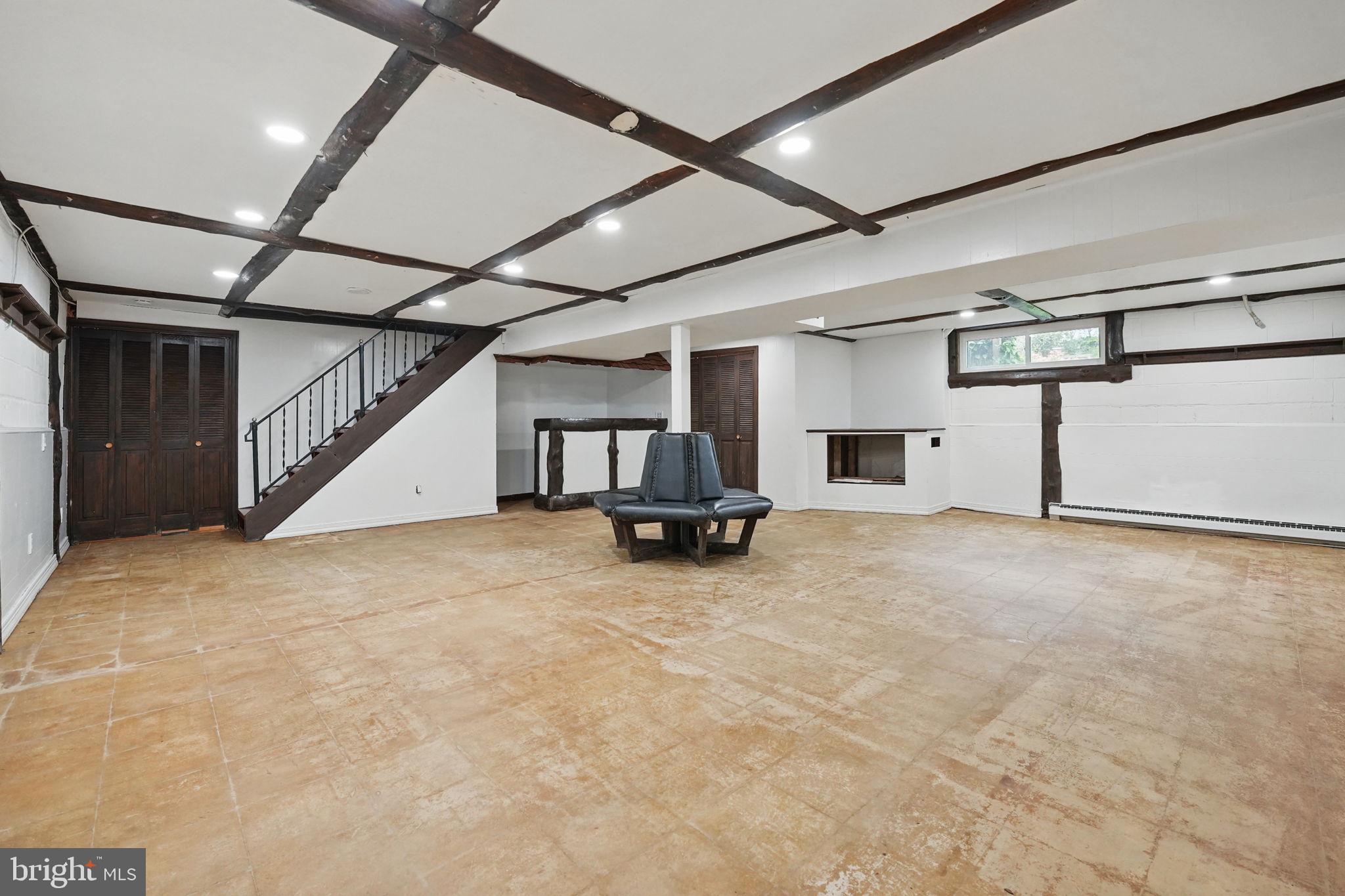 2524 Swift Run Street Vienna, VA 22180 - Photo 26 of 55 a view of a big room with staircase and a ceiling fan