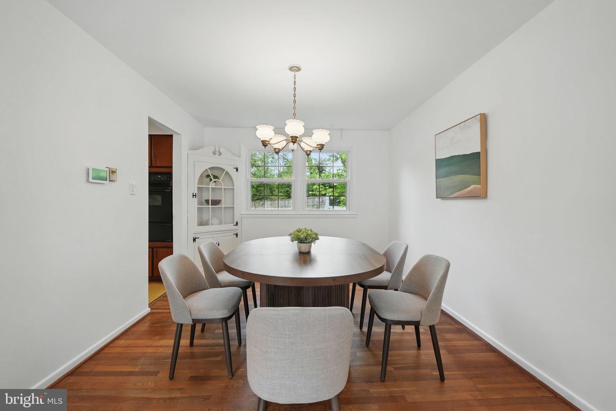 2524 Swift Run Street Vienna, VA 22180 - Photo 6 of 55 a dining room with furniture and window