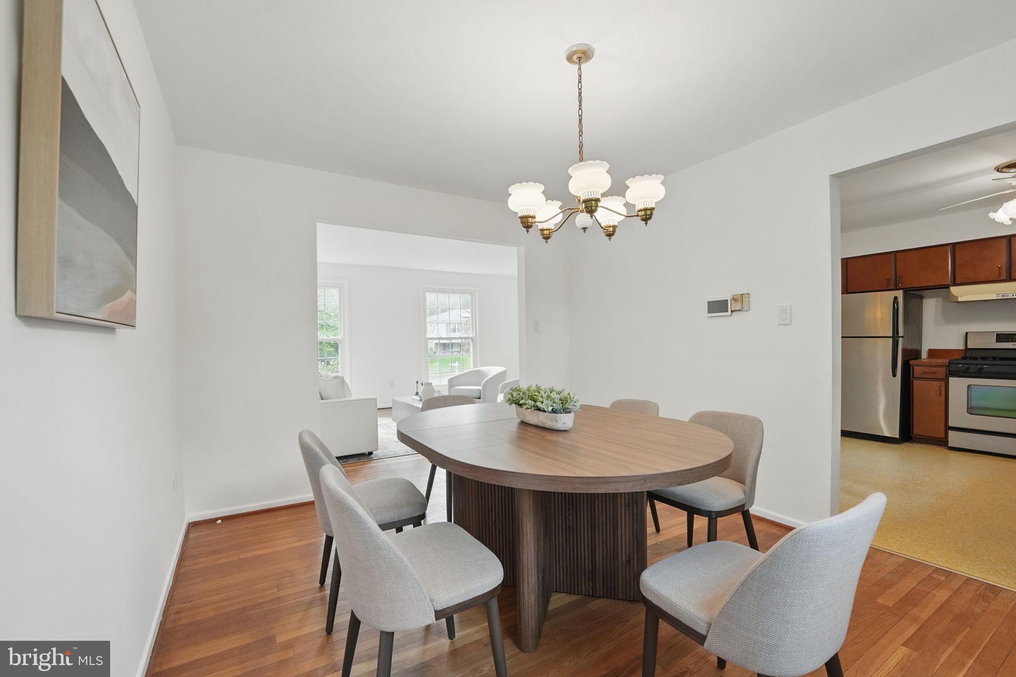 2524 Swift Run Street Vienna, VA 22180 - Photo 7 of 55 a view of a dining room with furniture and wooden floor