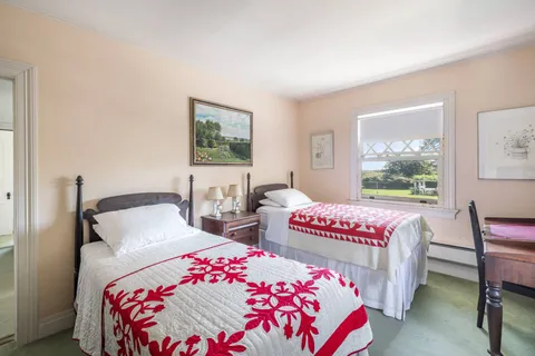 a bathroom with a sink mirror and vanity
