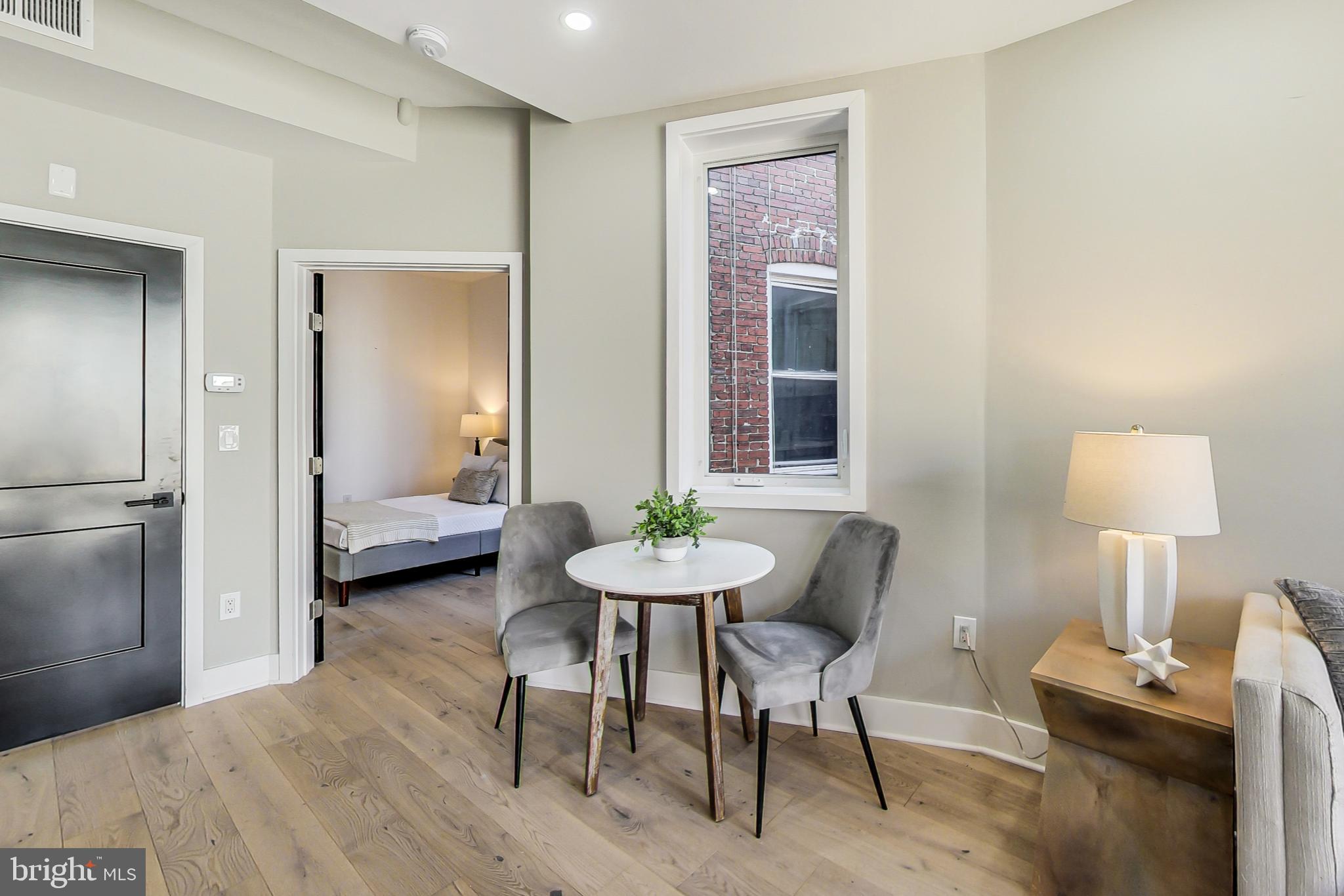 207 Florida Avenue Northwest, Unit 2 Washington, DC 20001 - Photo 7 of 18 a view of a room with furniture and wooden floor