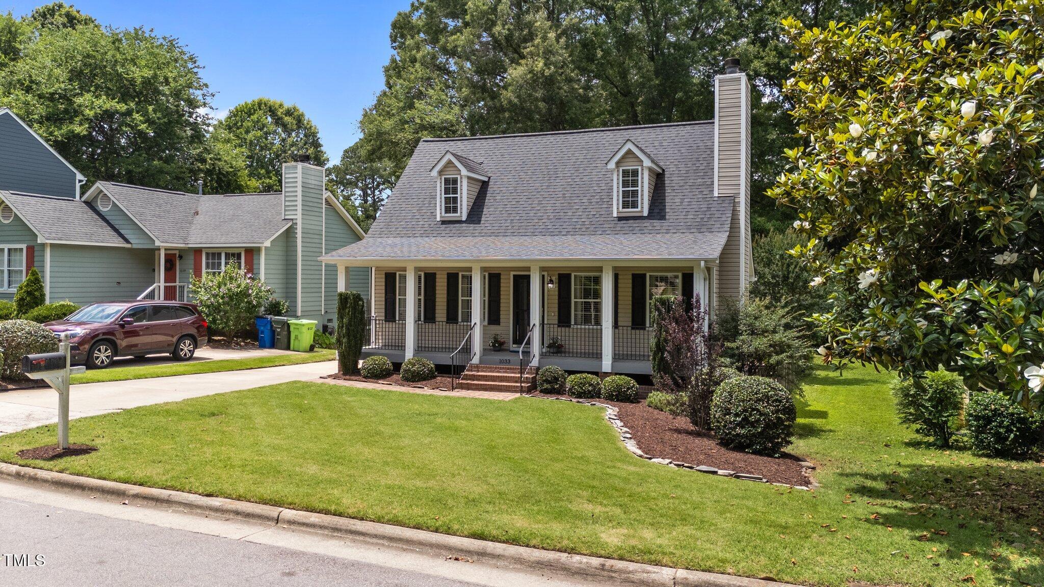 1033 Mills Street Raleigh, NC 27608 - Photo 3 of 36 3-web-or-mls-DJI_20250609132126_0942_D
