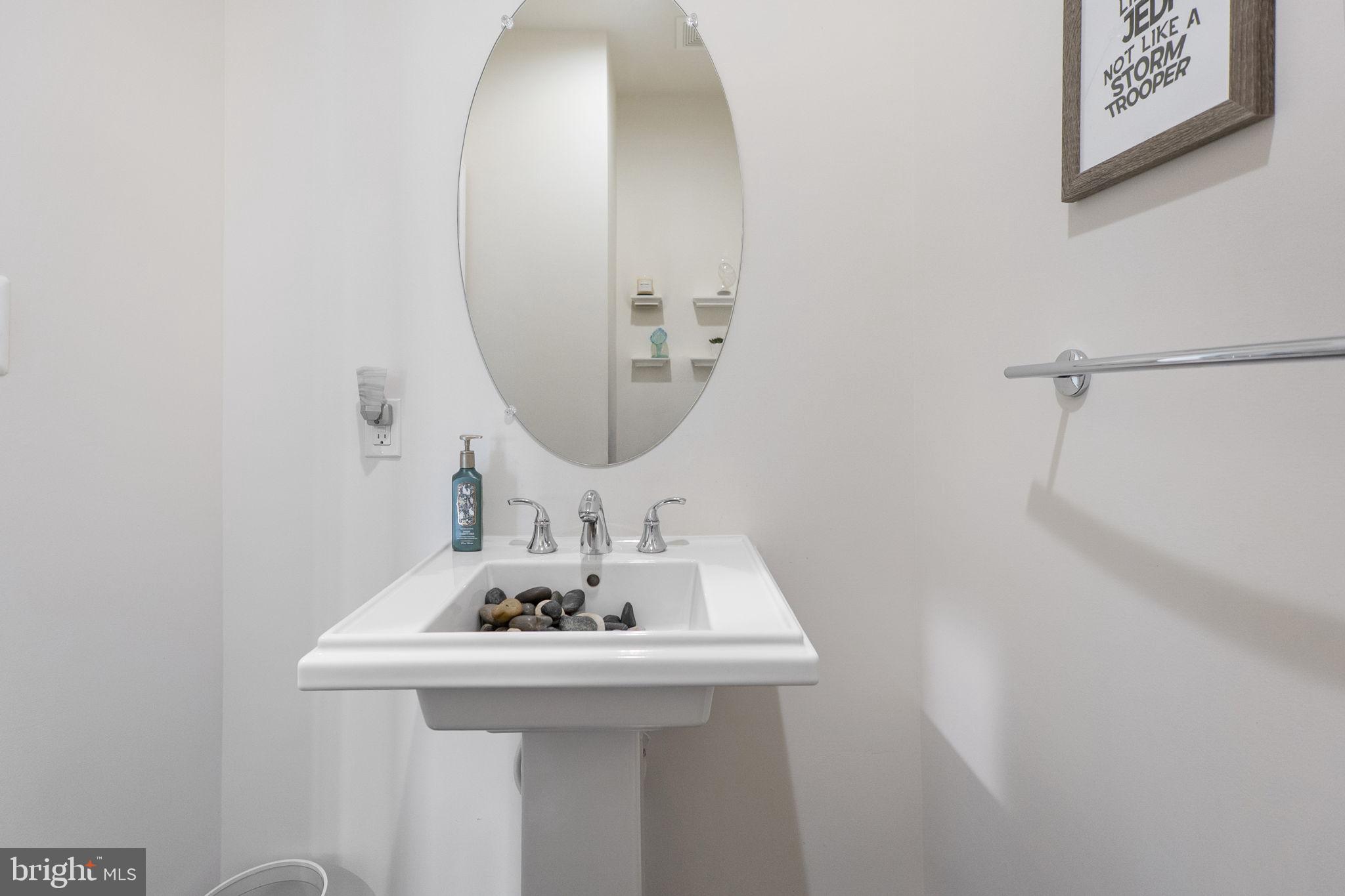 23902 Grapevine Ridge Terrace Clarksburg, MD 20871 - Photo 15 of 44 a bathroom with a sink and a mirror