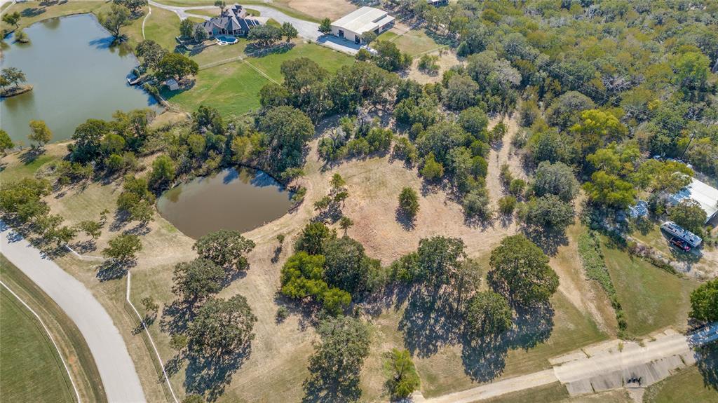 Tbd Mountain View Road Aubrey, TX 76227 - Photo 11 of 16 an aerial view of a house with a yard and lake view