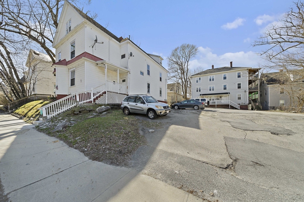 45 May Street Worcester, MA 01610 - Photo 31 of 34 a building view with couple of cars parked in front of it