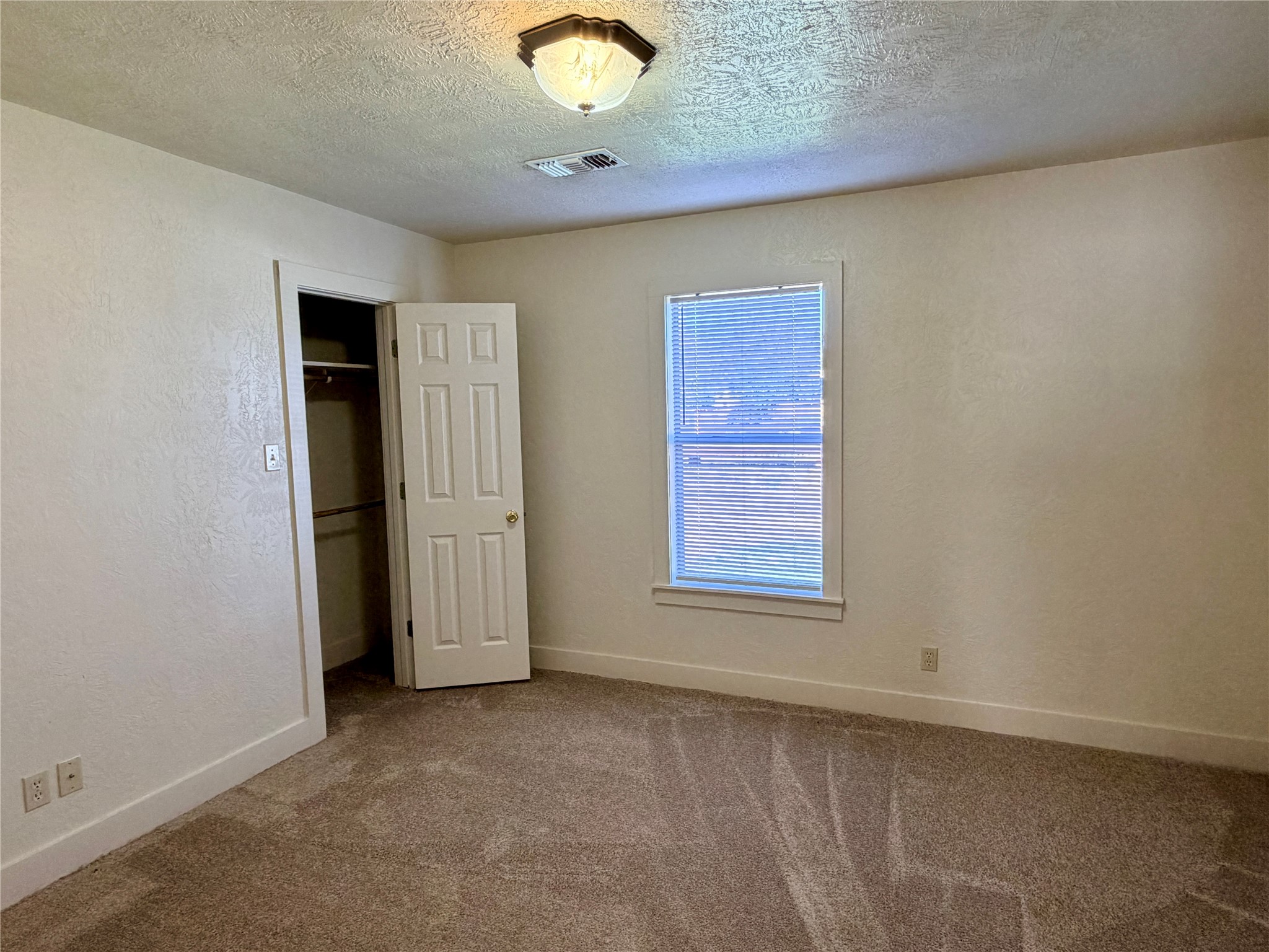 500 West Third Street Brenham, TX 77833 - Photo 12 of 16 an empty room with windows