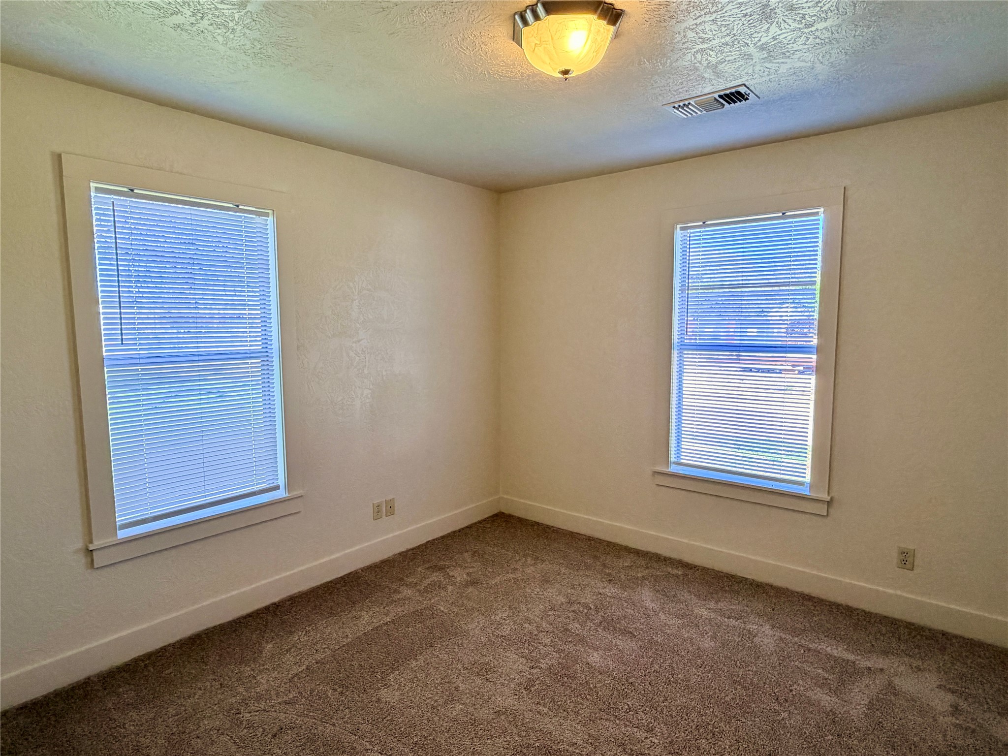 500 West Third Street Brenham, TX 77833 - Photo 14 of 16 an empty room with windows