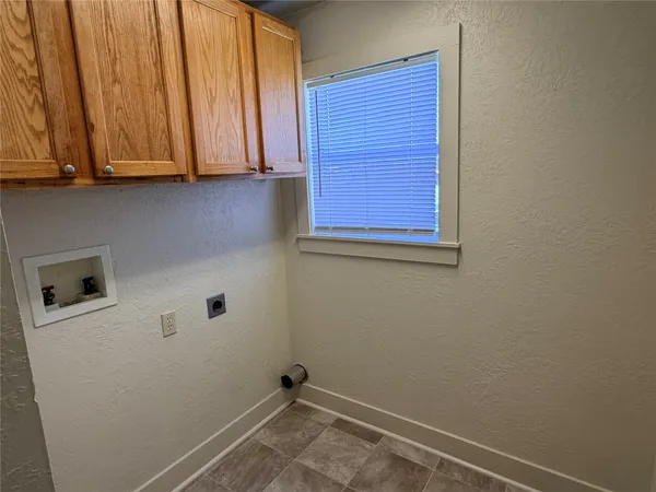 a view of storage and utility room with washer and dryer