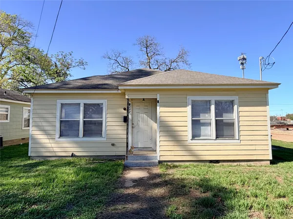 a front view of a house with garage