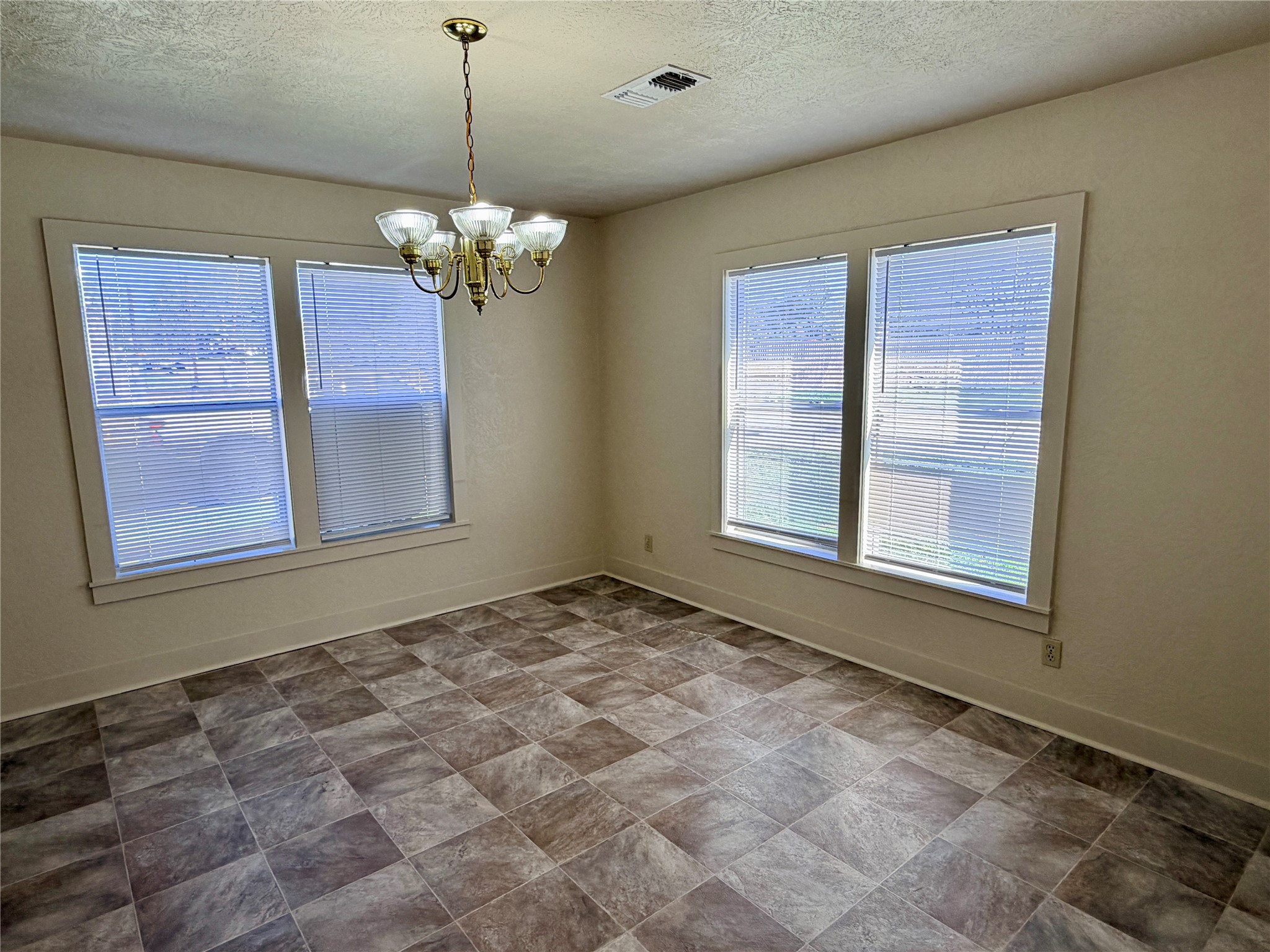 500 West Third Street Brenham, TX 77833 - Photo 7 of 16 a view of an empty room with a window