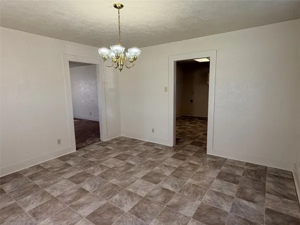 a view of a chandelier in an empty room