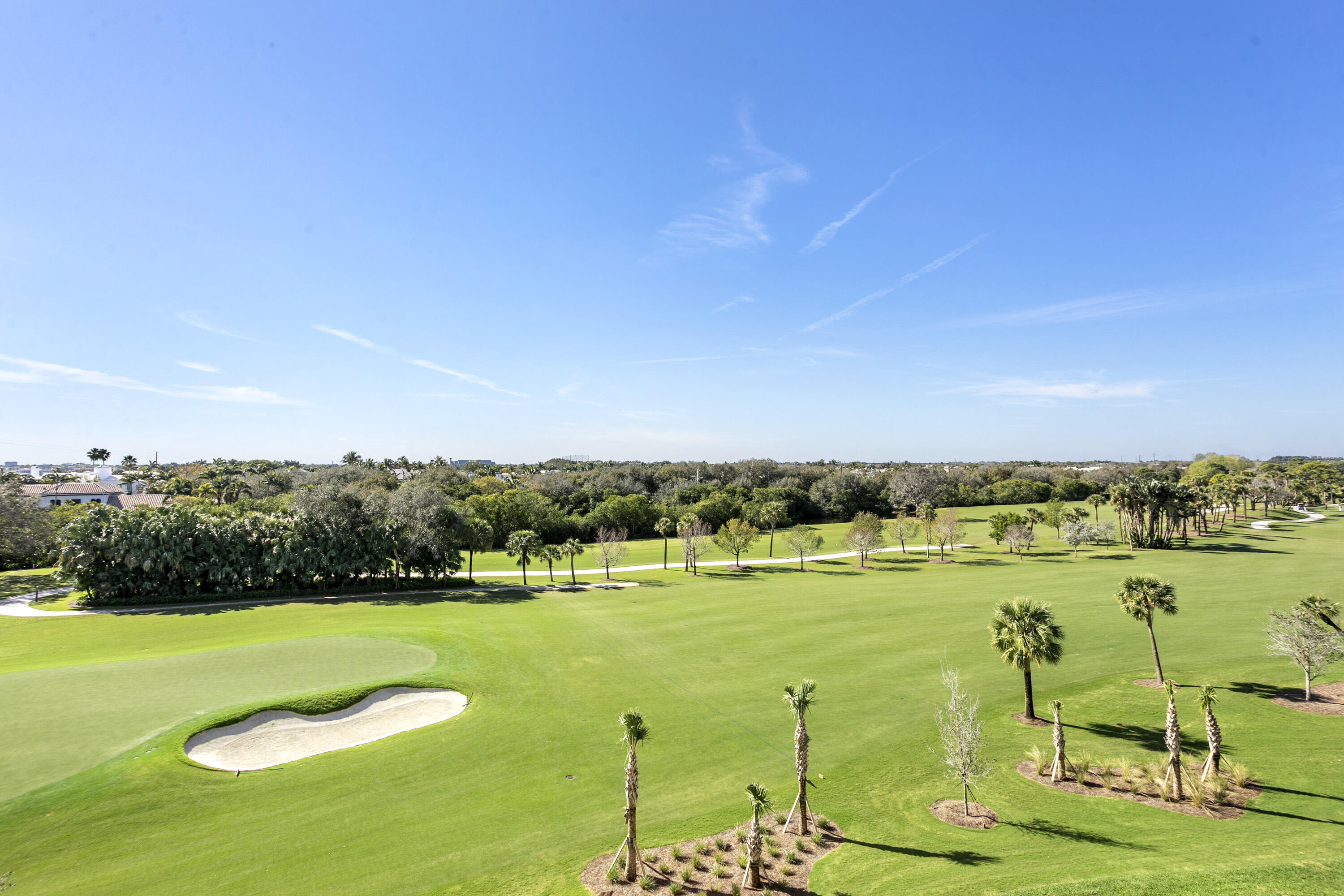 3322 Casseekey Island Road, Unit 504 Jupiter, FL 33477 - Photo 32 of 46 a view of a golf course with an ocean
